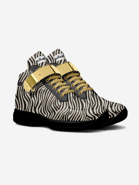 Pair of Superboost zebra print high-top sneakers with gold laces and buckles.