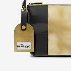 Black and gold purse with BYMANYC tag, a stylish accessory.