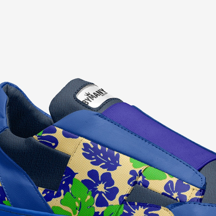 Blue slip-on shoe featuring BYMANYC label and colorful floral pattern.