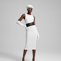 Woman wearing white sleeveless midi dress, beret, gloves, sunglasses, wide belt.