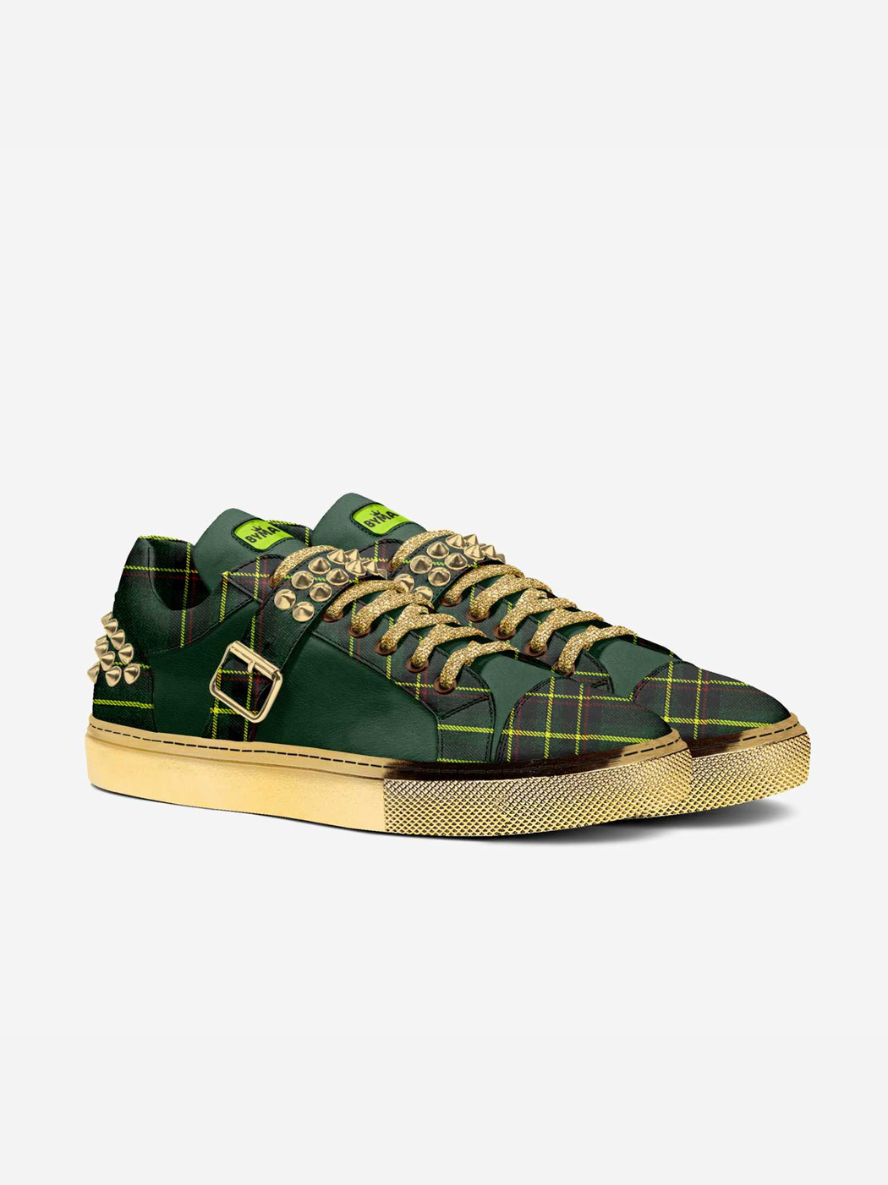 Luxury green tartan sneakers featuring gold laces, studs, buckle, and soles.