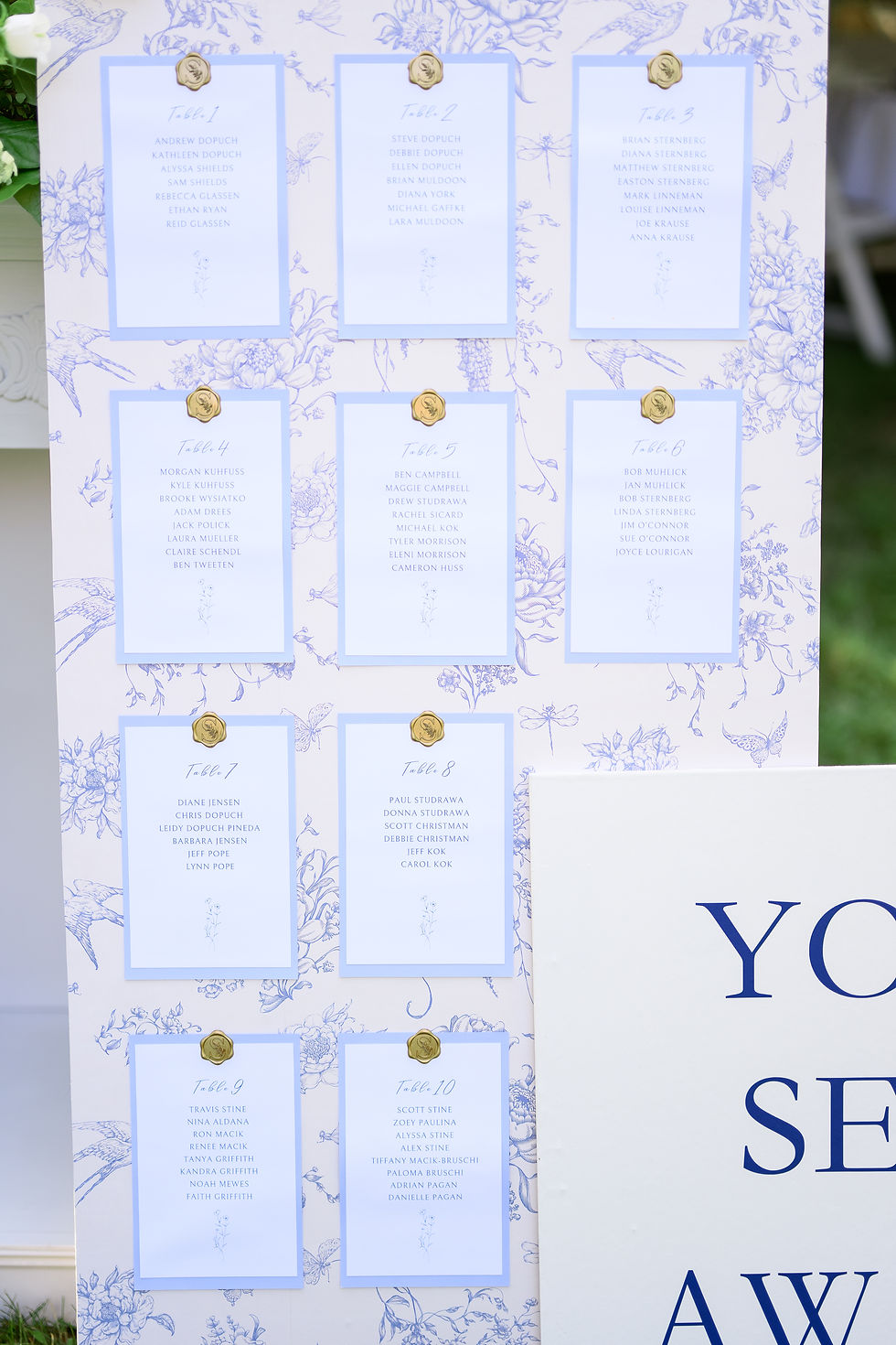 Close-up of wedding reception table assignments