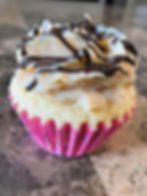 Coconut Cupcake with Toasted Coconut Frosting and Chocolate Drizzle