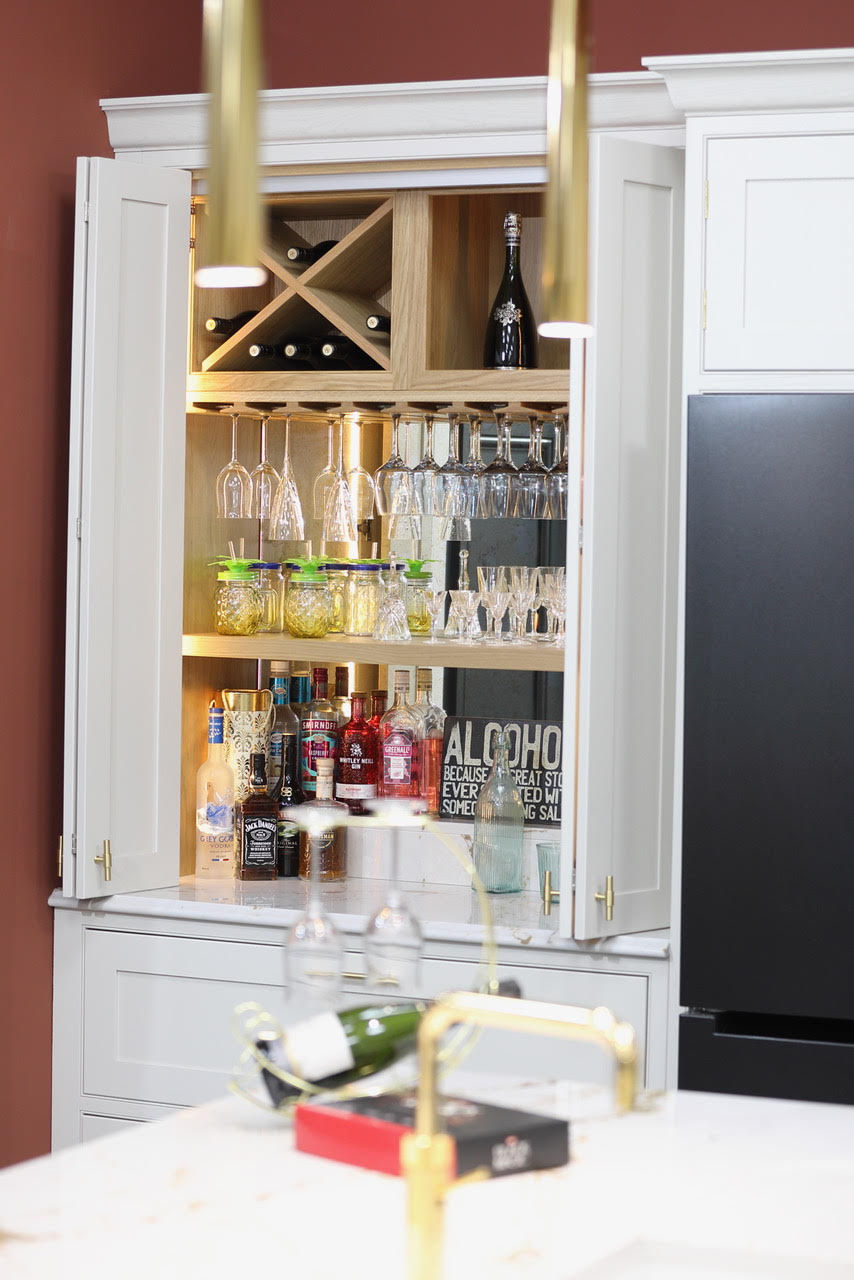 Built-in kitchen wine rack with glasses and bottles