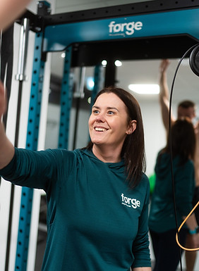Lynda Brudenell looking at a patient's shoulder