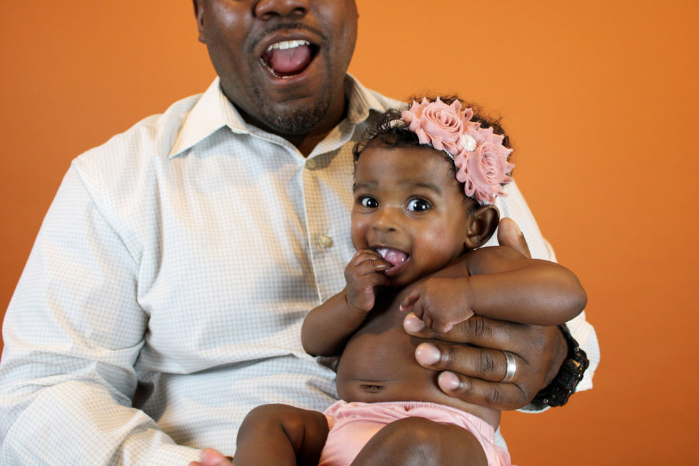 Smiling Dad with baby girl.