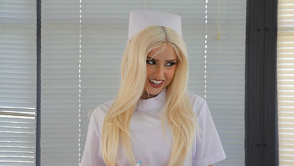 A still from a video featuring two men and a nurse character.