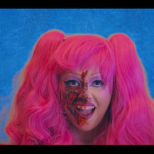 A still from a grid video of a pink haired character.