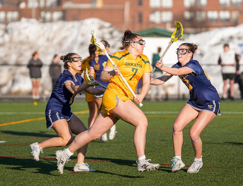# 7 Hailey Lewkovich battling through traffic against UofR on March 4 2026. Photo credit: Liv Metz / Brockport Athletics