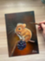 A detailed painting by artist Zuza Marlow of a small mouse perched on a wet blackberry, with delicate water droplets glistening on the fruit and its textured surface. The composition highlights fine detail in the mouse’s fur and the rich, dark tones of the berry, creating a delicate, naturalistic scene.