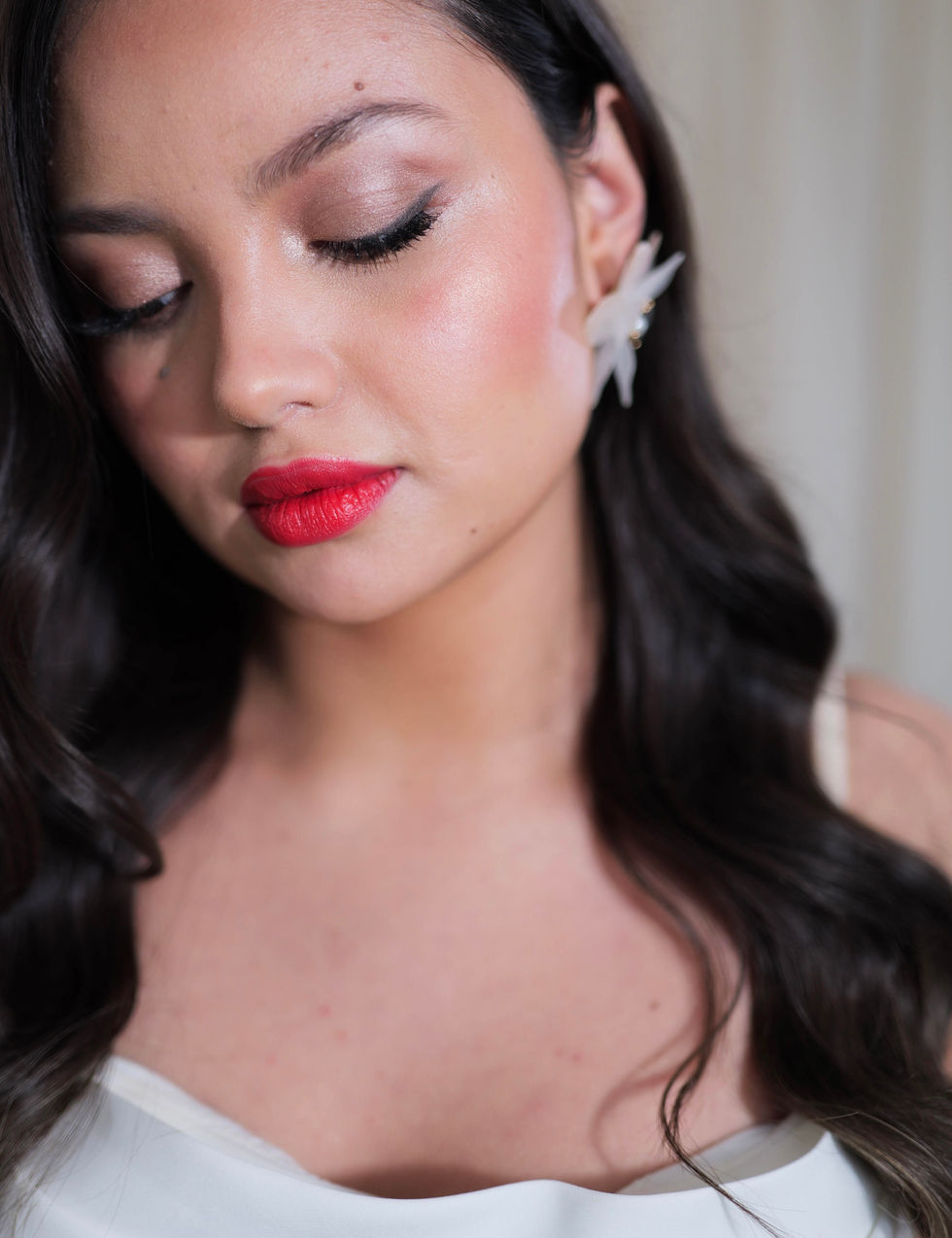 a close up of a woman 's face with red lipstick