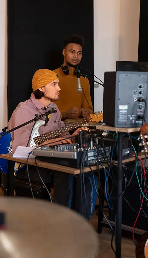 side-view-musicians-working-studio.webp