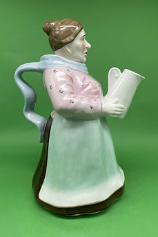 Woman holding Pitcher teapot - England circa 1920