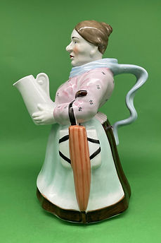 Woman holding Pitcher teapot - England circa 1920