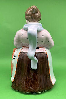 Woman holding Pitcher teapot - England circa 1920