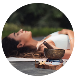 A close-up of a beautifully crafted sound bowl on a serene surface.