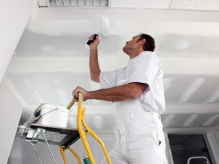 Man painting a ceiling