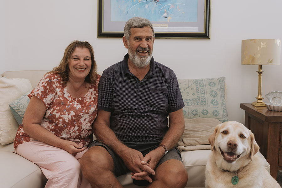 Longridge residents relaxing in their villa with their dog