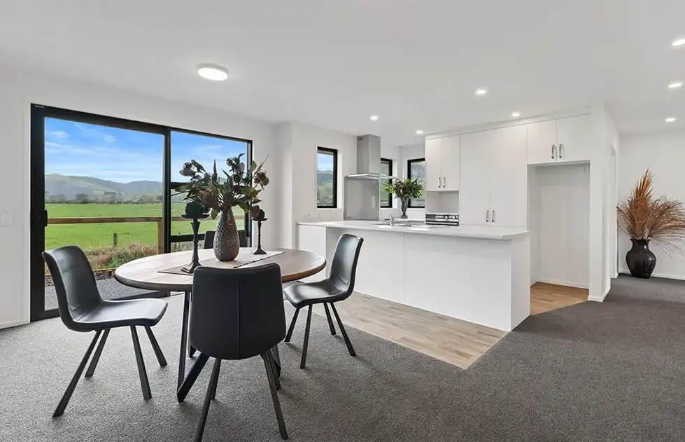 Open plan kitchen and dining area in Maratoto style villa at Longridge Country Estate, Paeroa