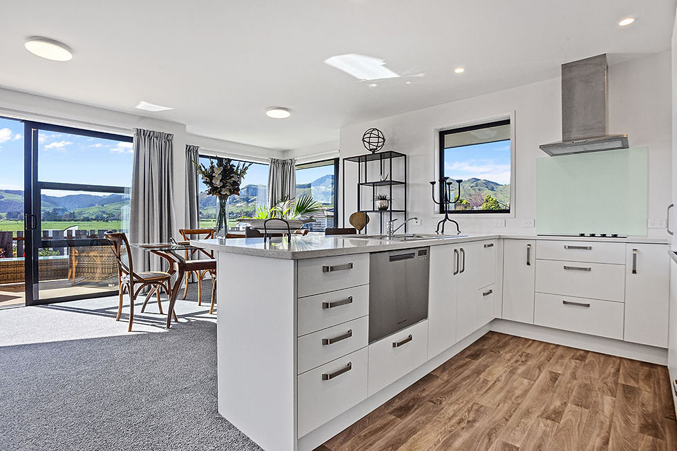 Modern Longridge villa kitchen with stone benchtops and open-plan dining