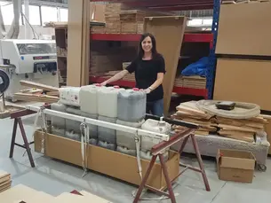 Becs Bartells in New Zealand workshop manufacturing cardboard caskets