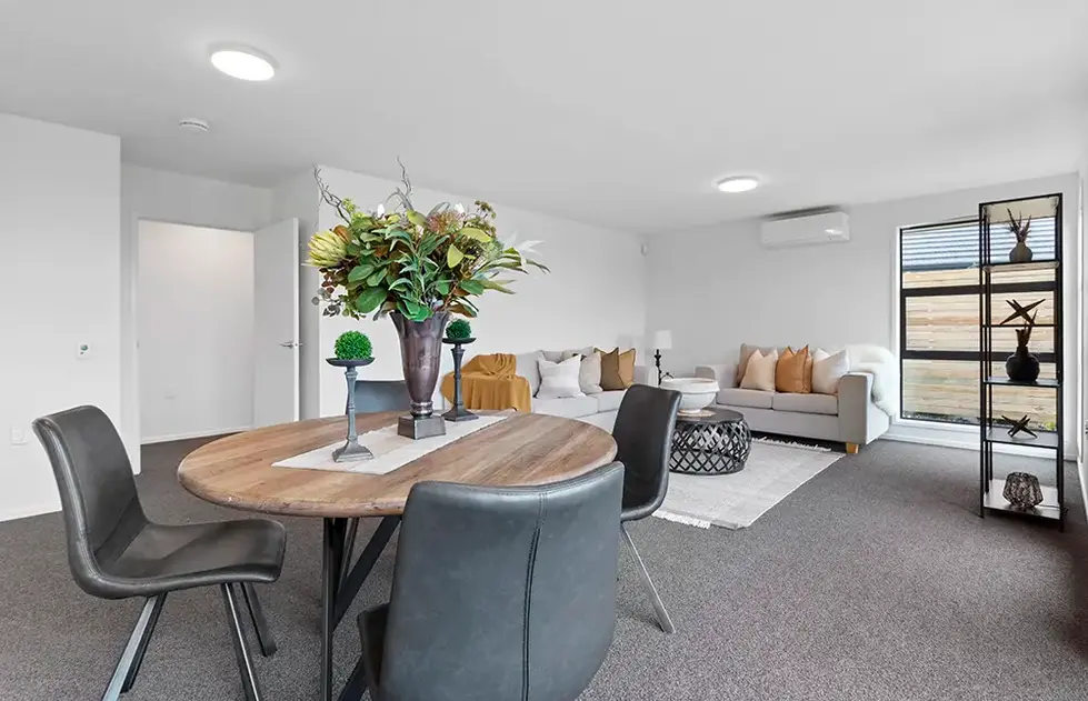Dining and lounge area in Maratoto style villa at Longridge Country Estate, Paeroa
