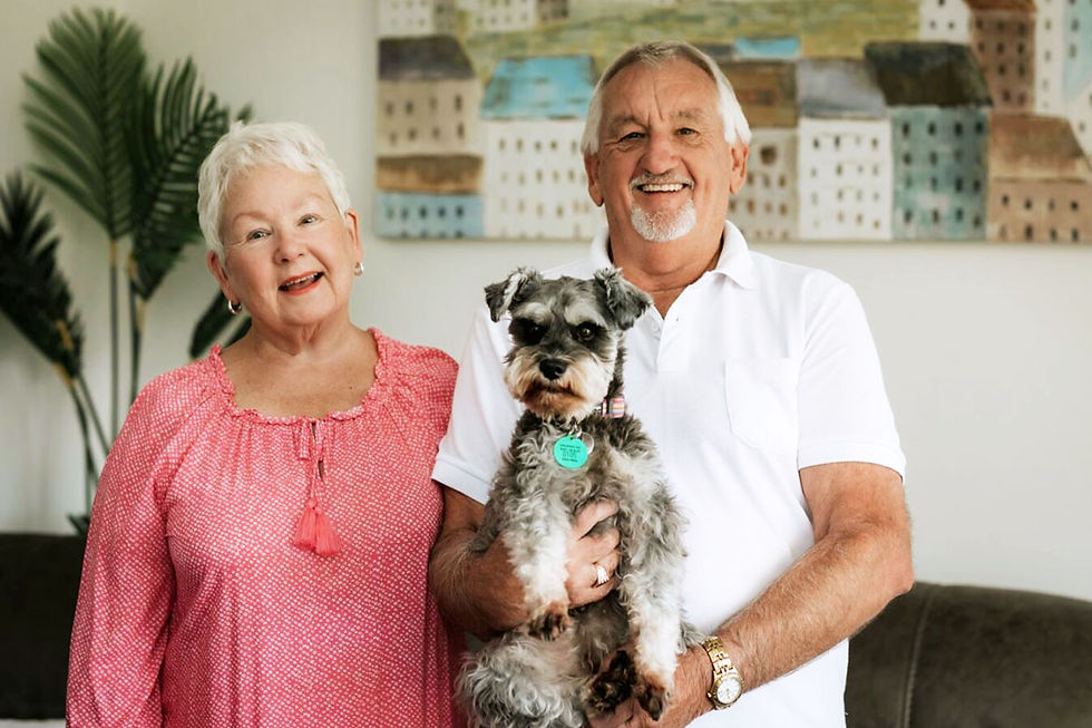 A Longridge Country Estate couple with their dog enjoying life in their villa.