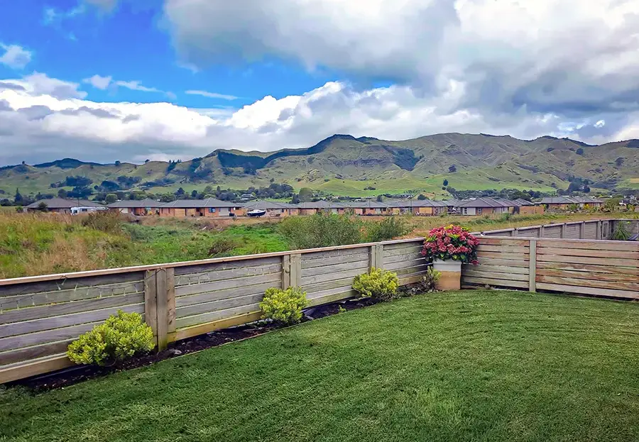 Private garden and lawn at 18 Orchid Drive, Longridge Country Estate retirement village in Paeroa with views toward the Coromandel hills.