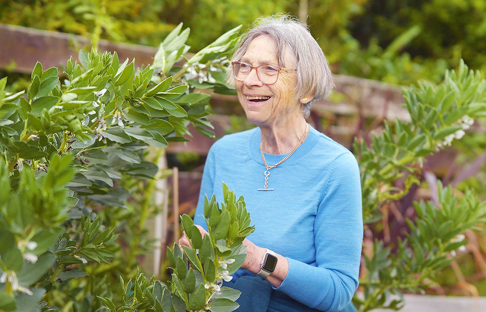 Longridge resident tending to her garden in the villageās shared green spaces.