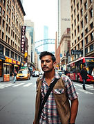a south asian man walking on the streets of sydney .jpg