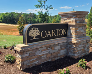 Custom stone monument sign for Oakton neighborhood entrance in Greenville, SC