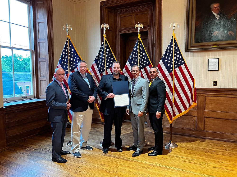 Pictured from left to right: NJAC Executive Director John Donadio, Hunterdon County Vocational School District Superintendent Todd Bonsall, Nathan was represented by his father, who was in attendance at the June 21st Commissioner Meeting, Board Director John E. Lanza, Board Deputy Director Zachary T. Rich