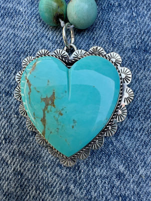 Close up view of large scalloped heart charm