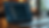 Eye-level view of a laptop screen showing Wix website editor with code window open