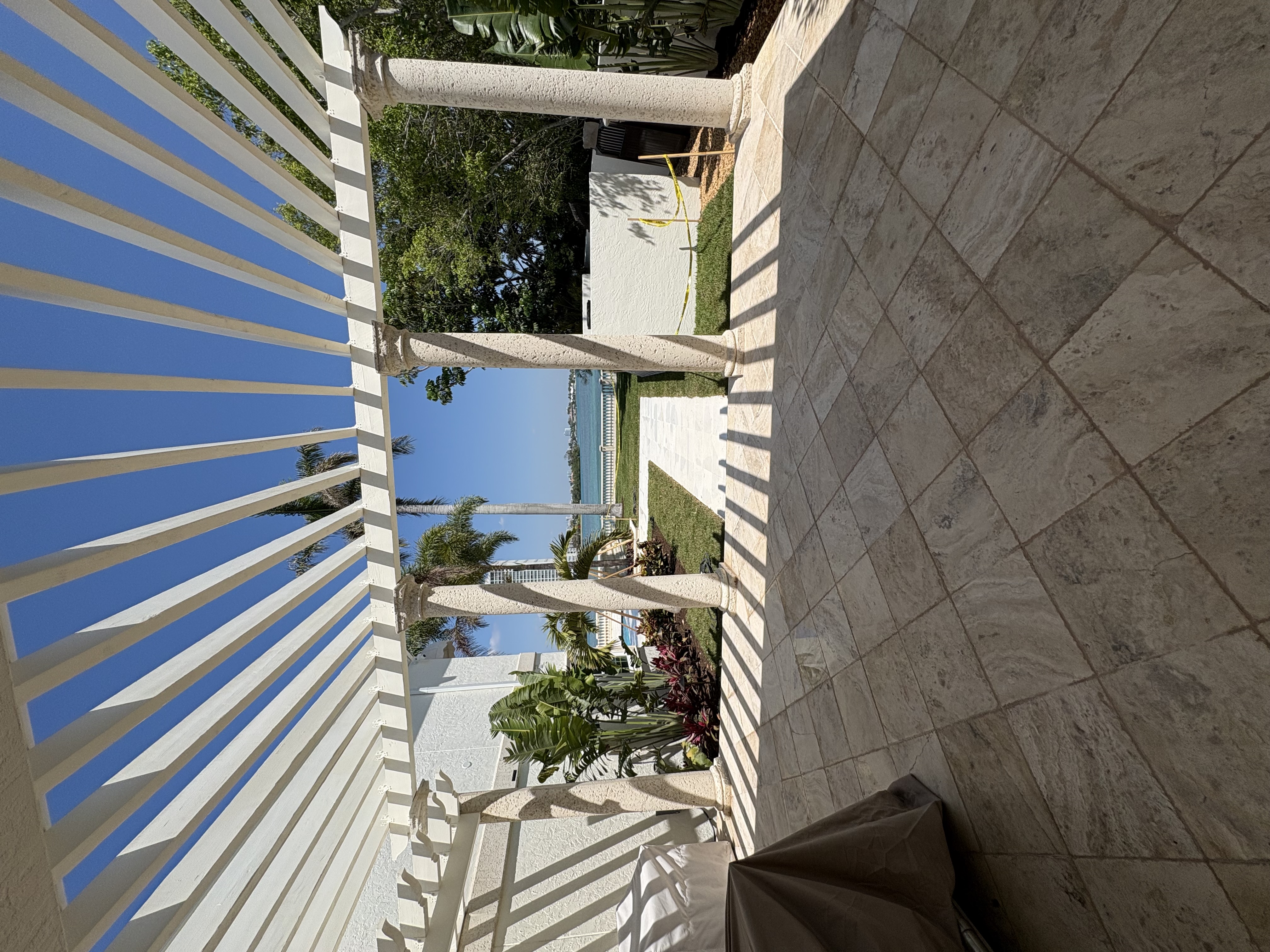 Beautiful Florida home with a professionally cleaned driveway and walkway after exterior house washing and pressure washing service.