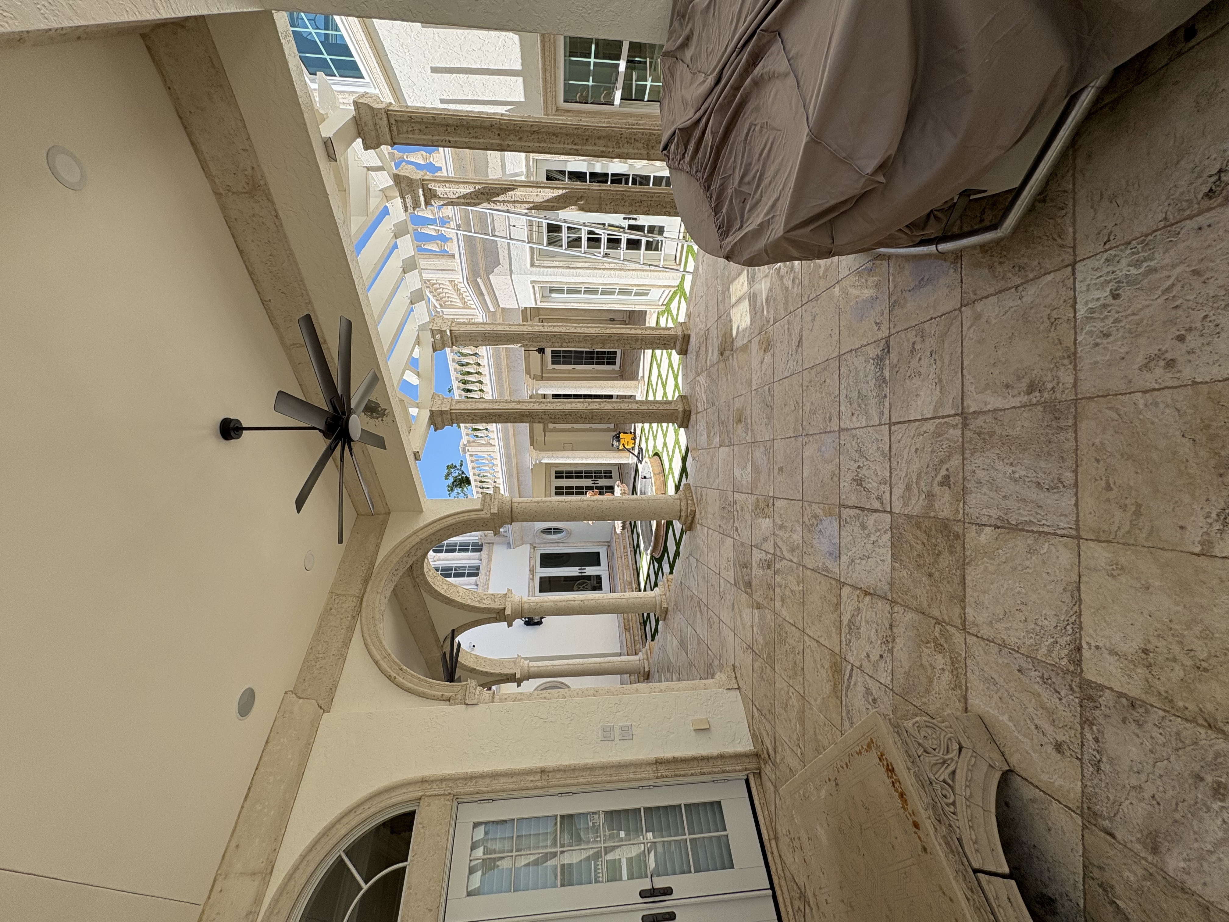 Beautiful Florida home with a professionally cleaned driveway and walkway after exterior house washing and pressure washing service.