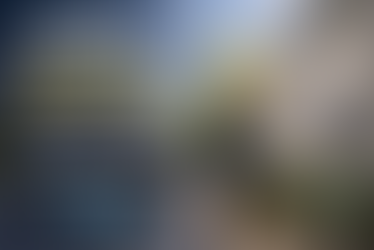 Contractor pressure washing a house with truck mounted pressure washing skid while text reads March is where planning turns into execution for pressure washing contractors.