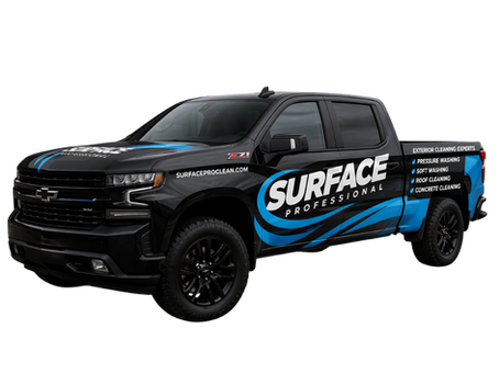 Commercial pressure washing team cleaning a business exterior in North Florida and South Georgia for Surface Professional.