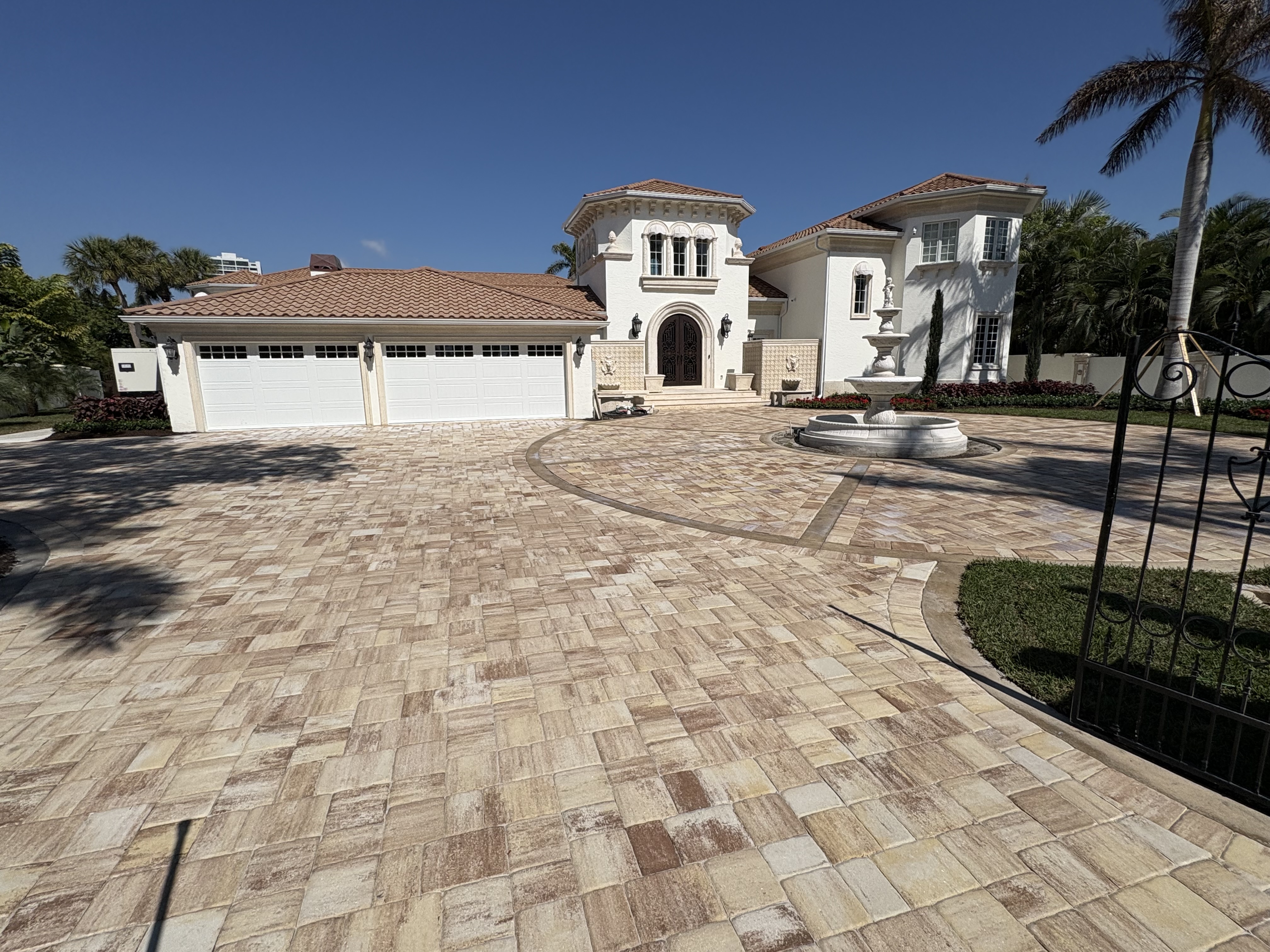 Professional pressure washing of a residential concrete driveway by Patrick's Pressure Washing, improving curb appeal and removing dirt and stains.
