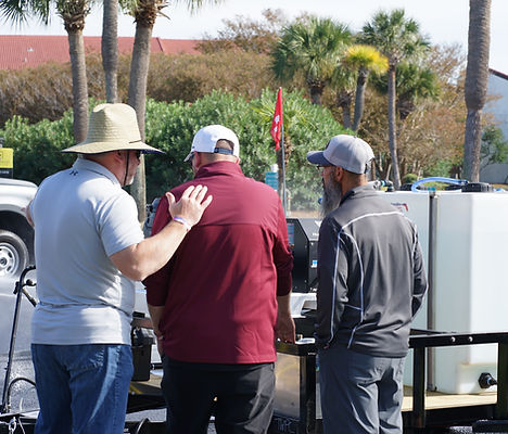 The Wash Works Team demoing and educating contractors fist hand how to use the Dual Wash Pro from Delco.