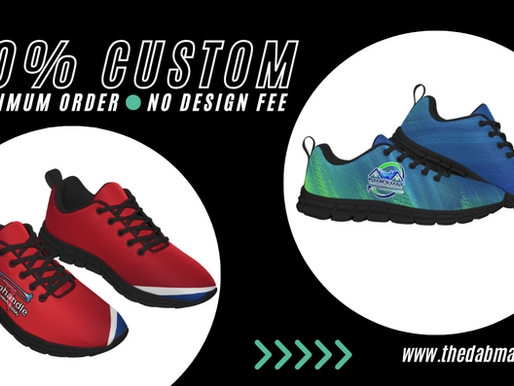 Custom sneakers displayed; one red with stripes, one blue-green with logo. Text: "100% Custom, No Minimum Order, No Design Fee." Website link below. Dab Marketing