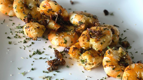 Crevettes sautées à l’ail 	