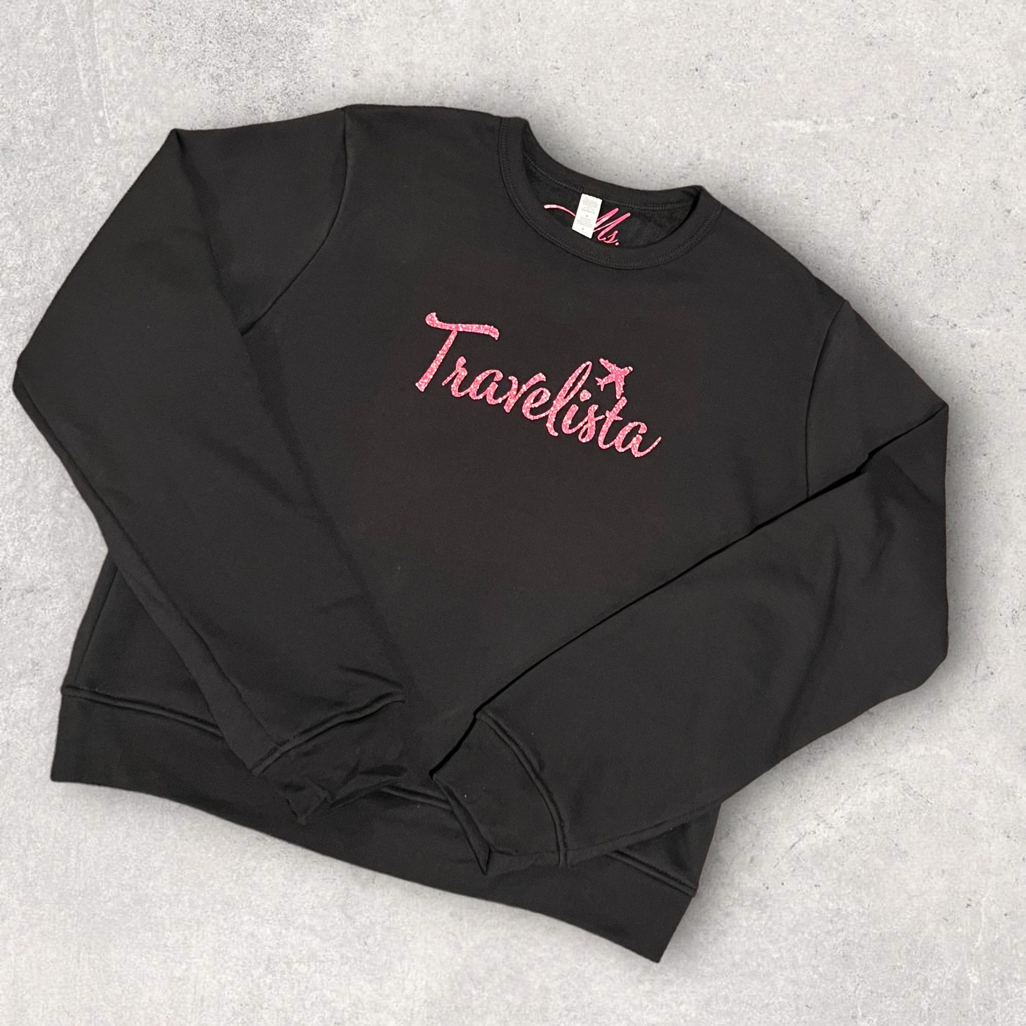 Black crewneck “Travelista” sweatshirt