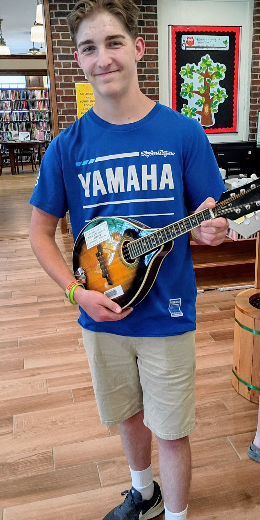 A happy Bonney Memorial Library Patron with a Mandolin!