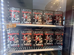 A frdidge stocked with Lagunitas Trooper West Coast IPA six packs