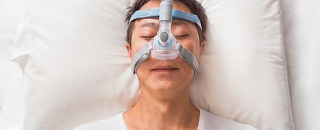 middle-age-asian-man-sleeping-his-bed-wearing-cpap-mask-people-with-sleep-apnea_41451-359