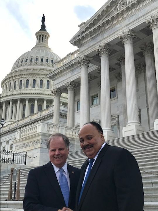 Sen. Doug Jones and Martin Luther King III chat outside the U.S. Capitol April 9, 2019. (Photo: Deborah Barfield Berry, USA TODAY)