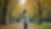 Eye-level view of a single person standing confidently in a quiet park