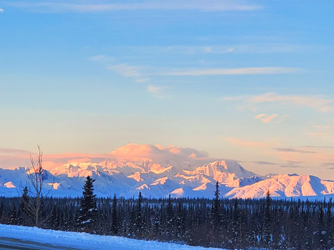 Alaskan mountain view of blue sky and snow mountain top