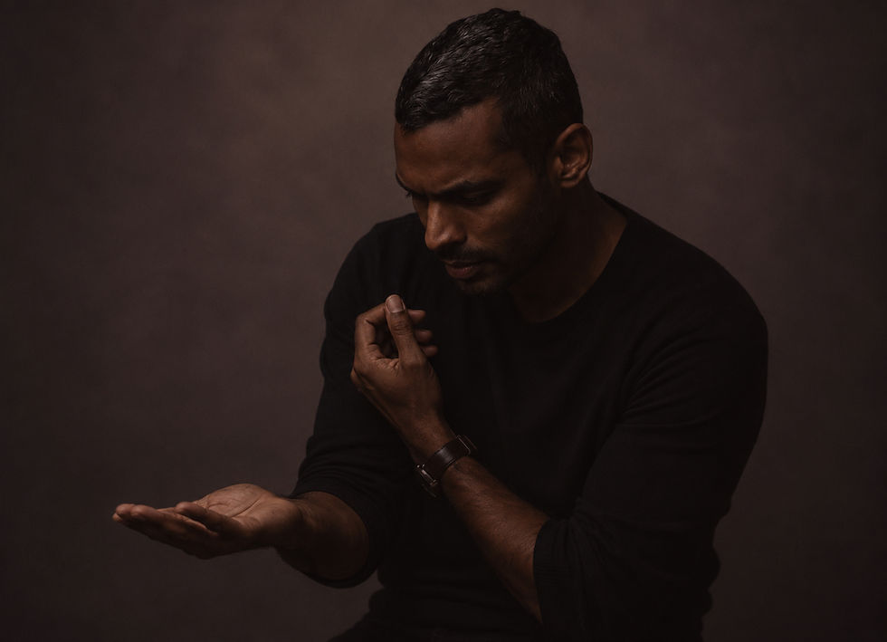 Man in a spiritual coaching session reflecting deeply.